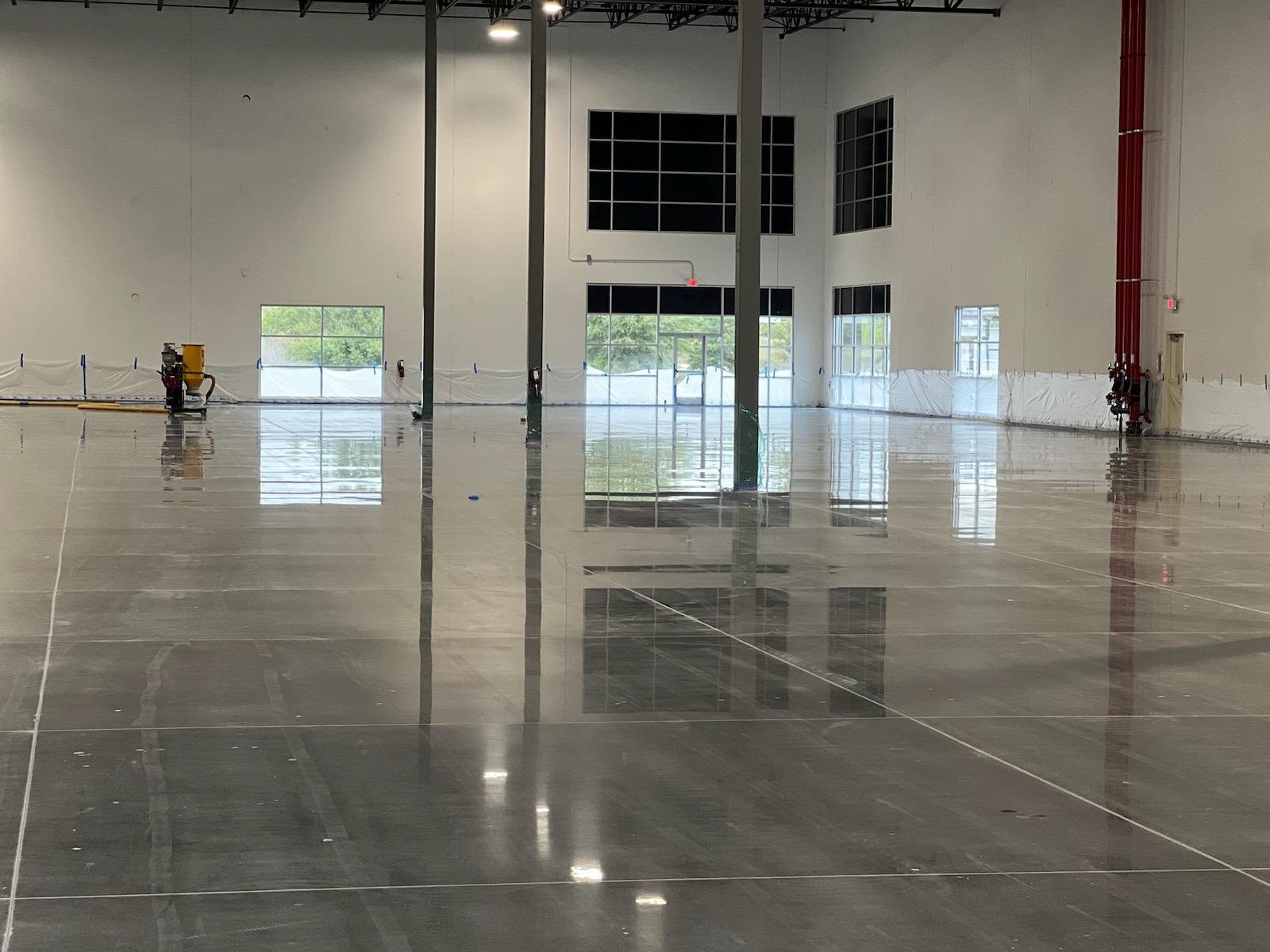 Window reflections demonstrating 3000-grit polished concrete clarity