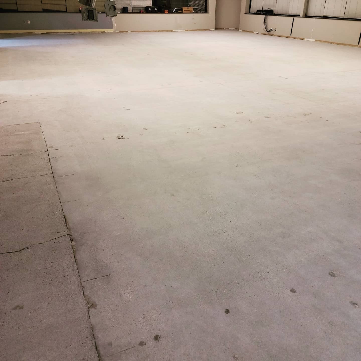 Original concrete surface with damage before coating