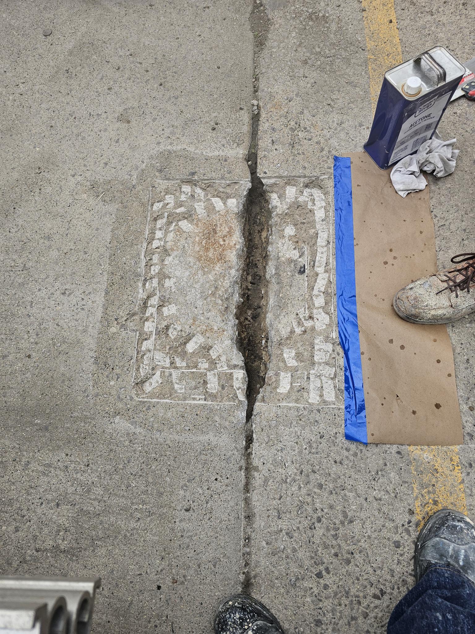 Concrete repair prep, joints cut and cleaned for trailer dolly pad