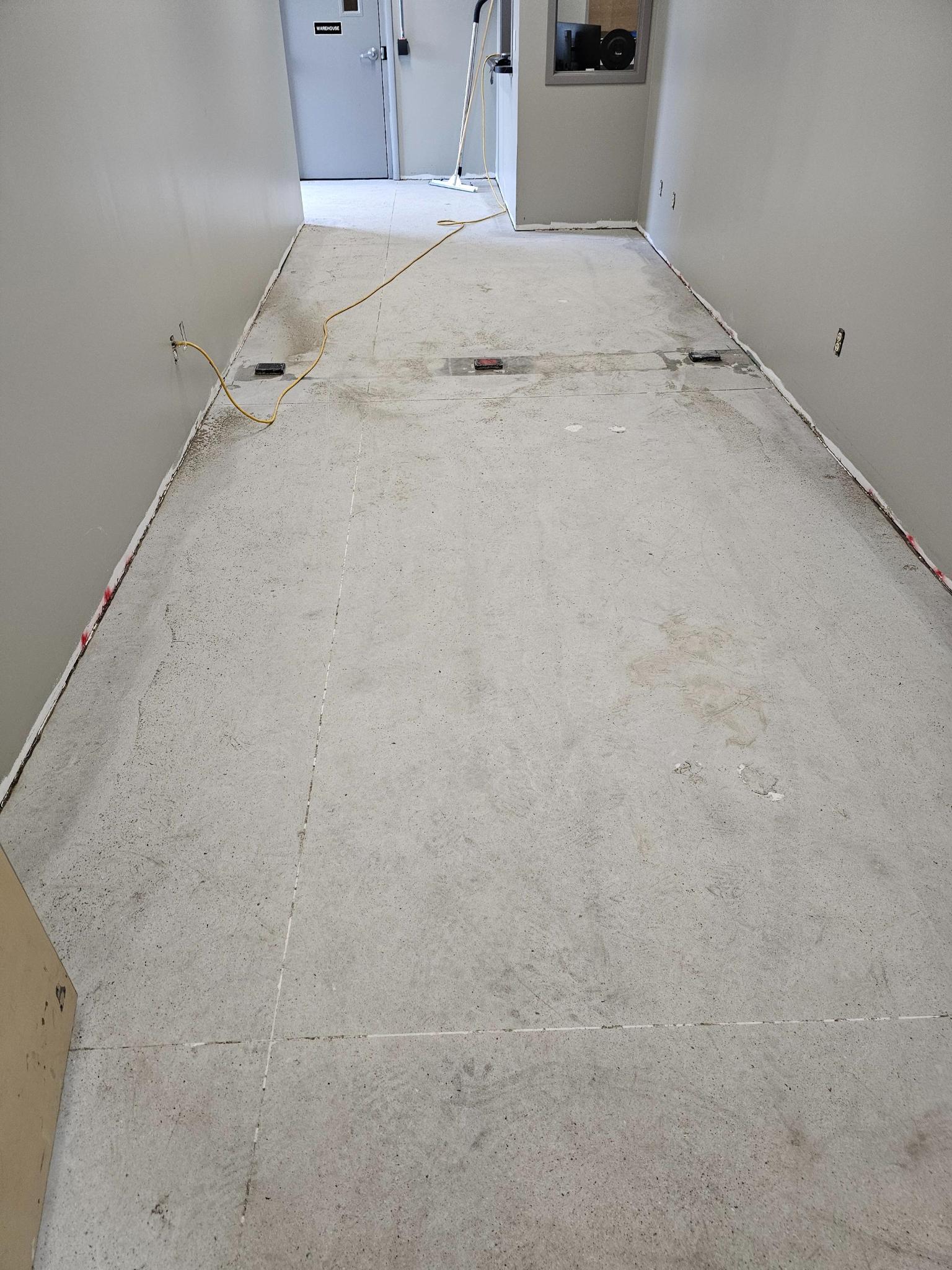 Prepared concrete surface with cove base forms in place