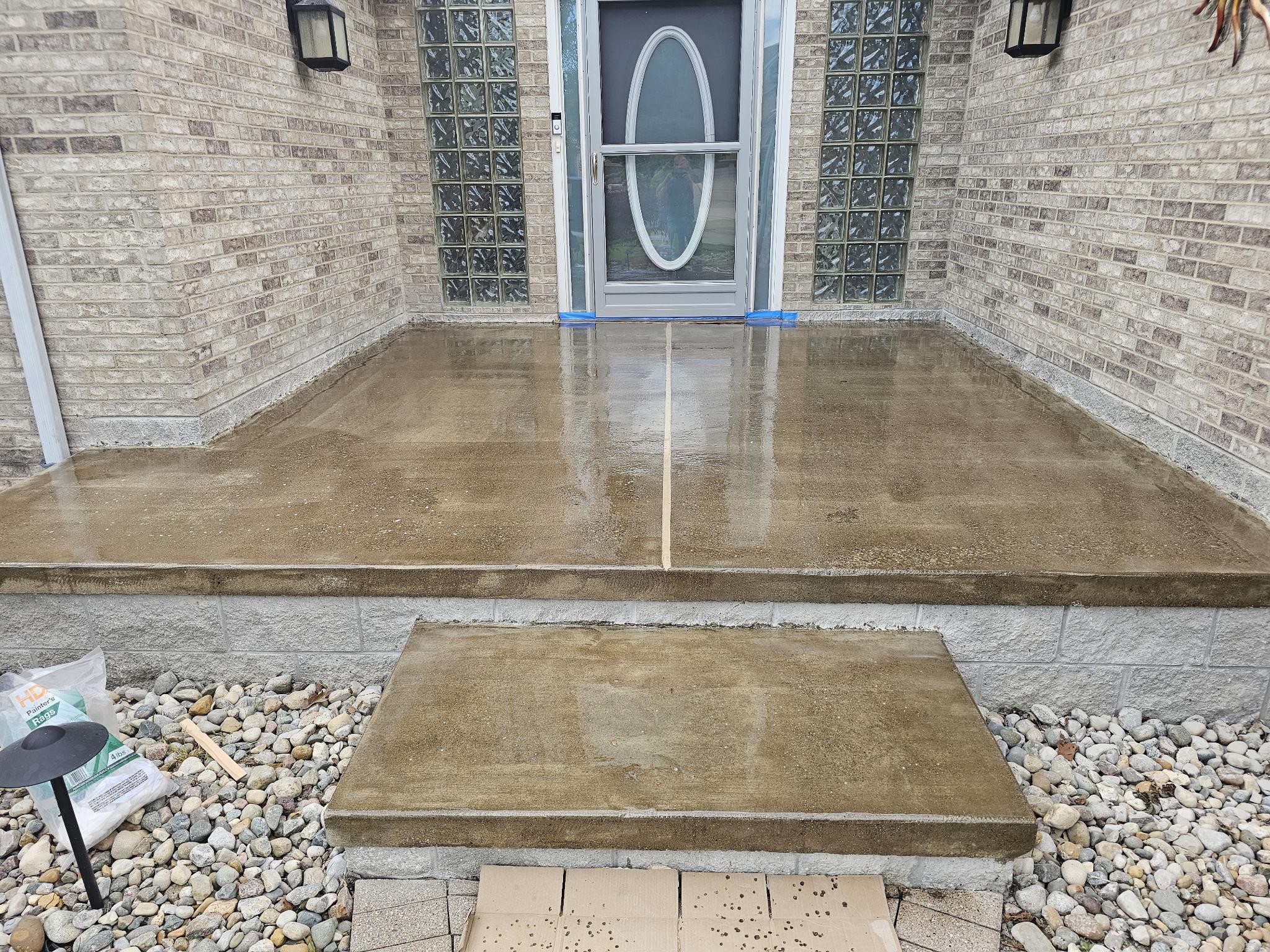 Deck coating application in progress, wet textured coating