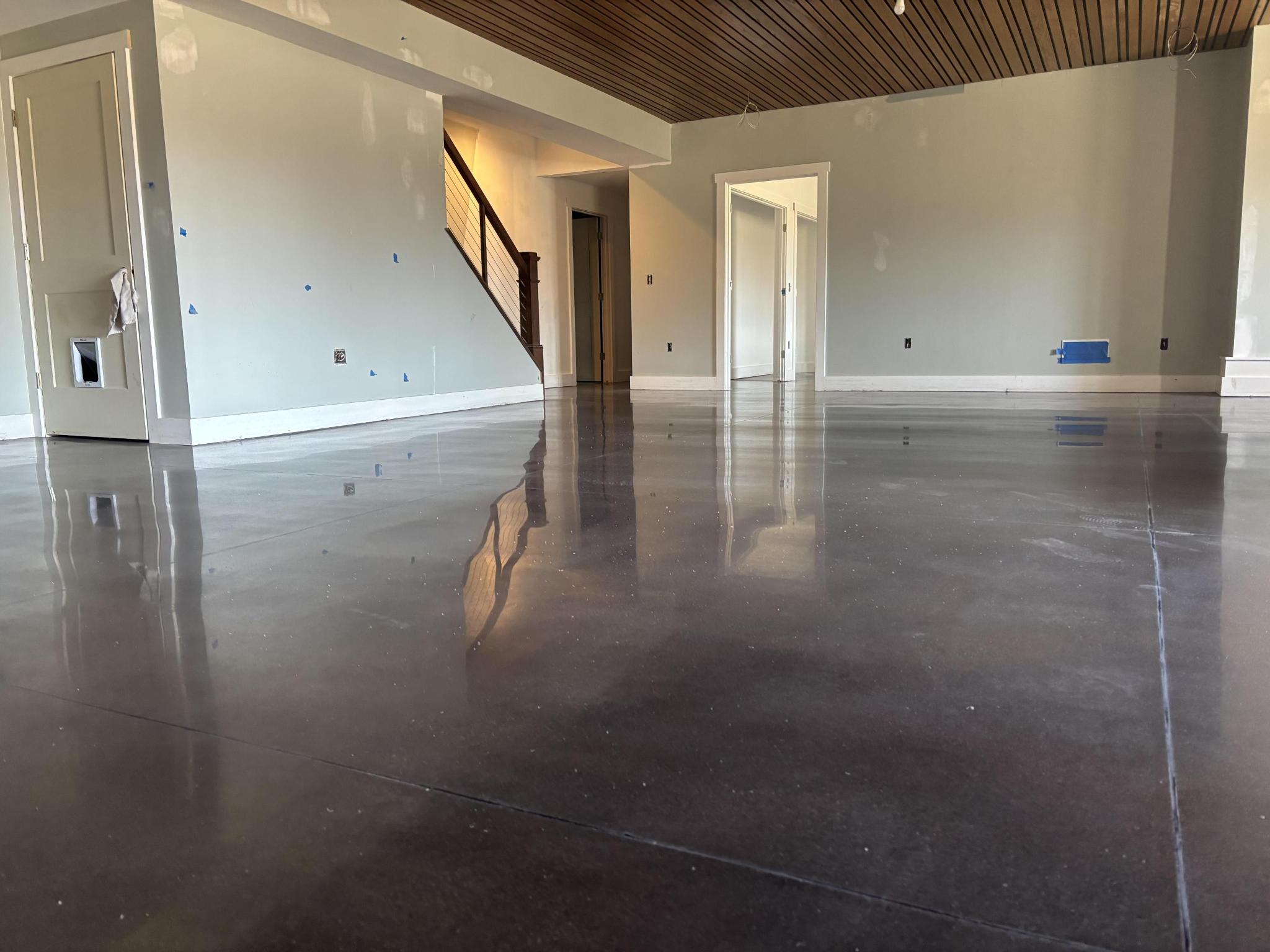 High-gloss double black stain finish in an open basement space