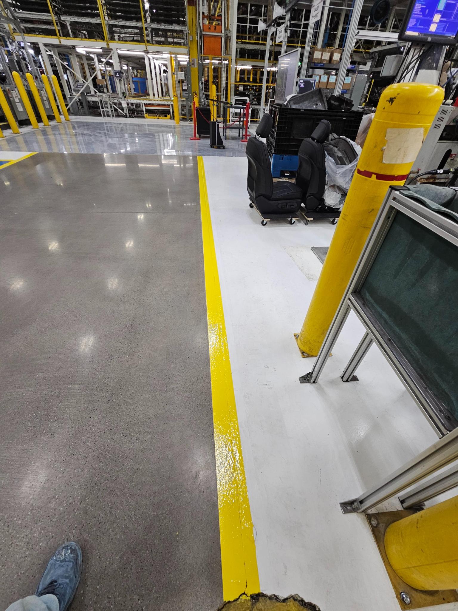 Magna Manufacturing white epoxy assembly line aisle