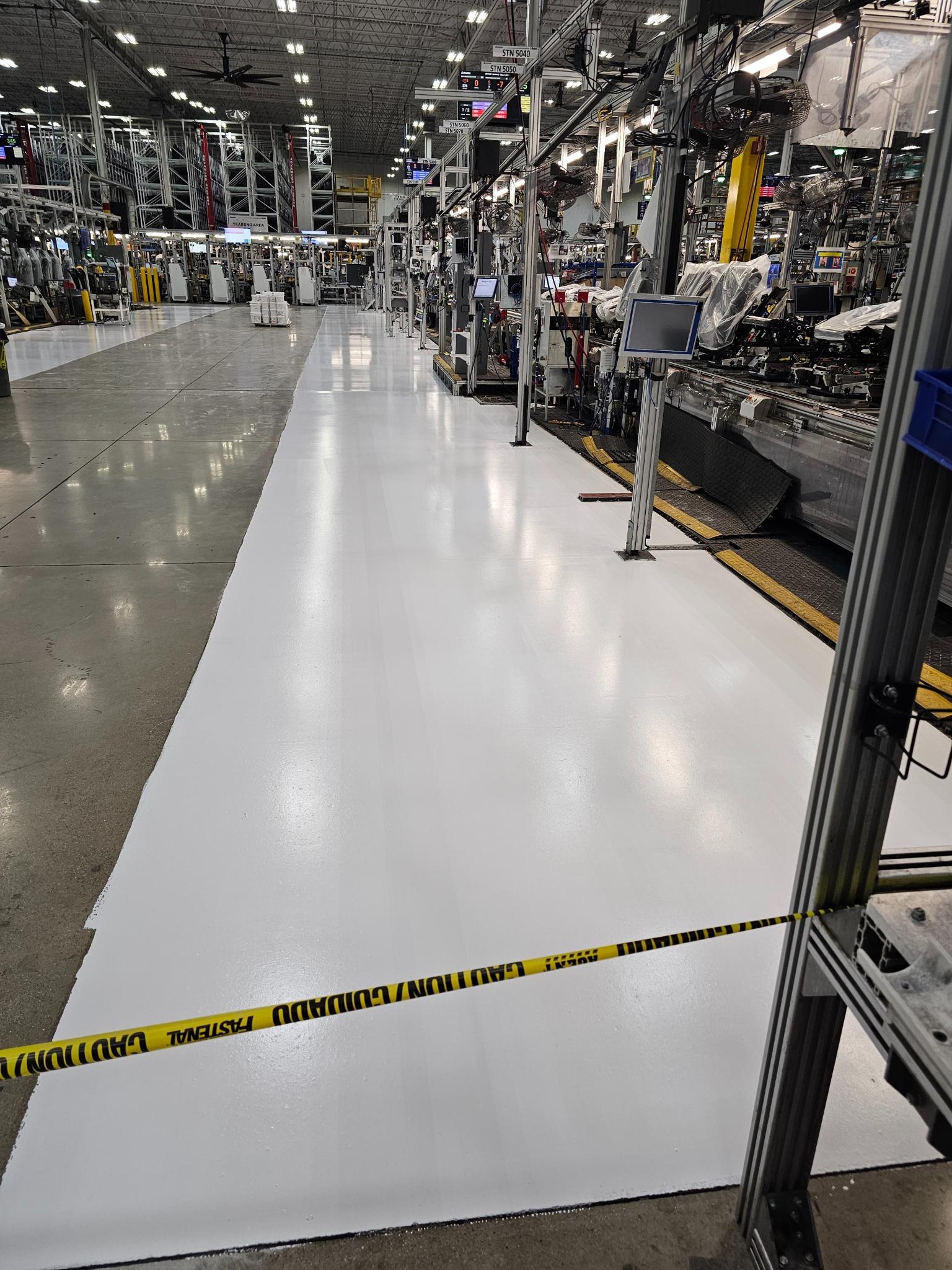White epoxy aisle with yellow safety lines