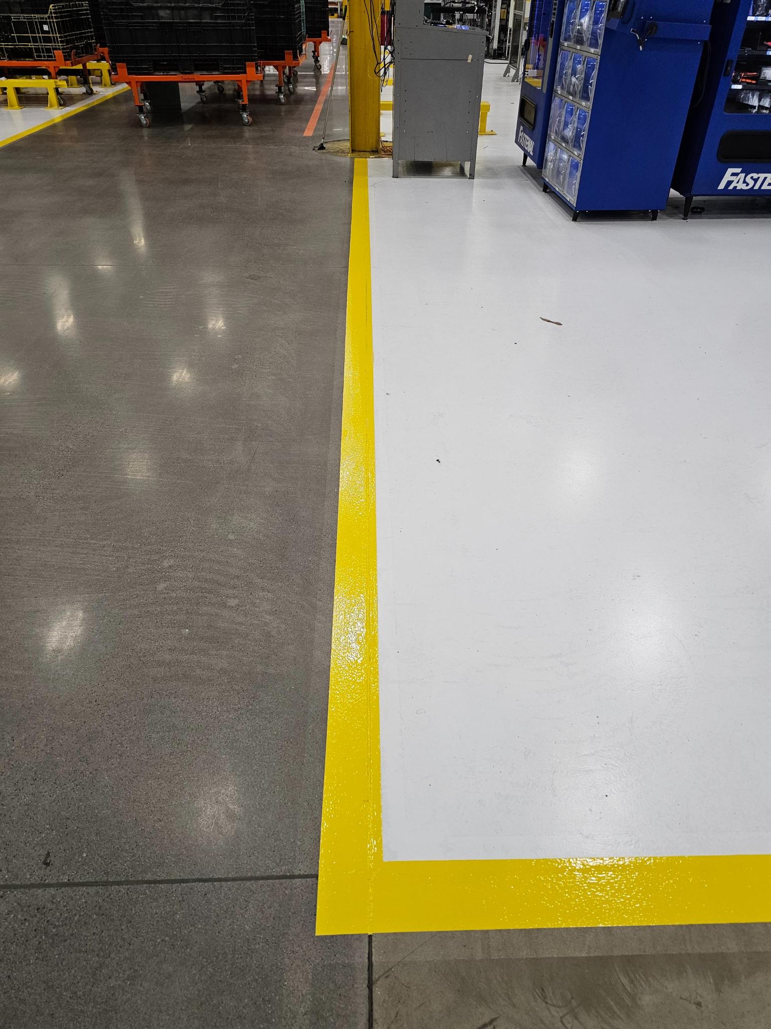 Manufacturing floor with safety line striping