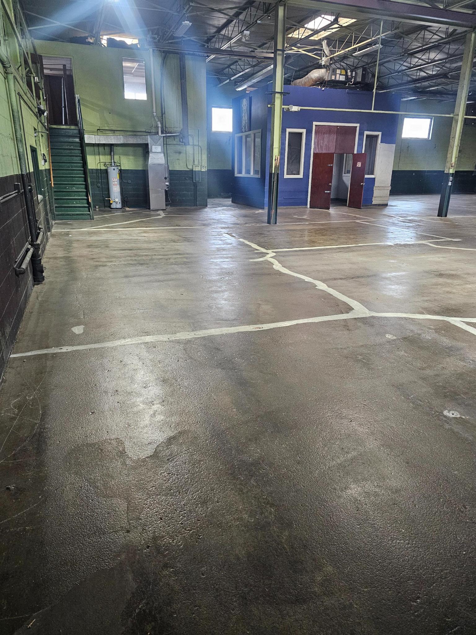 Distressed industrial floor surface before rejuvenation
