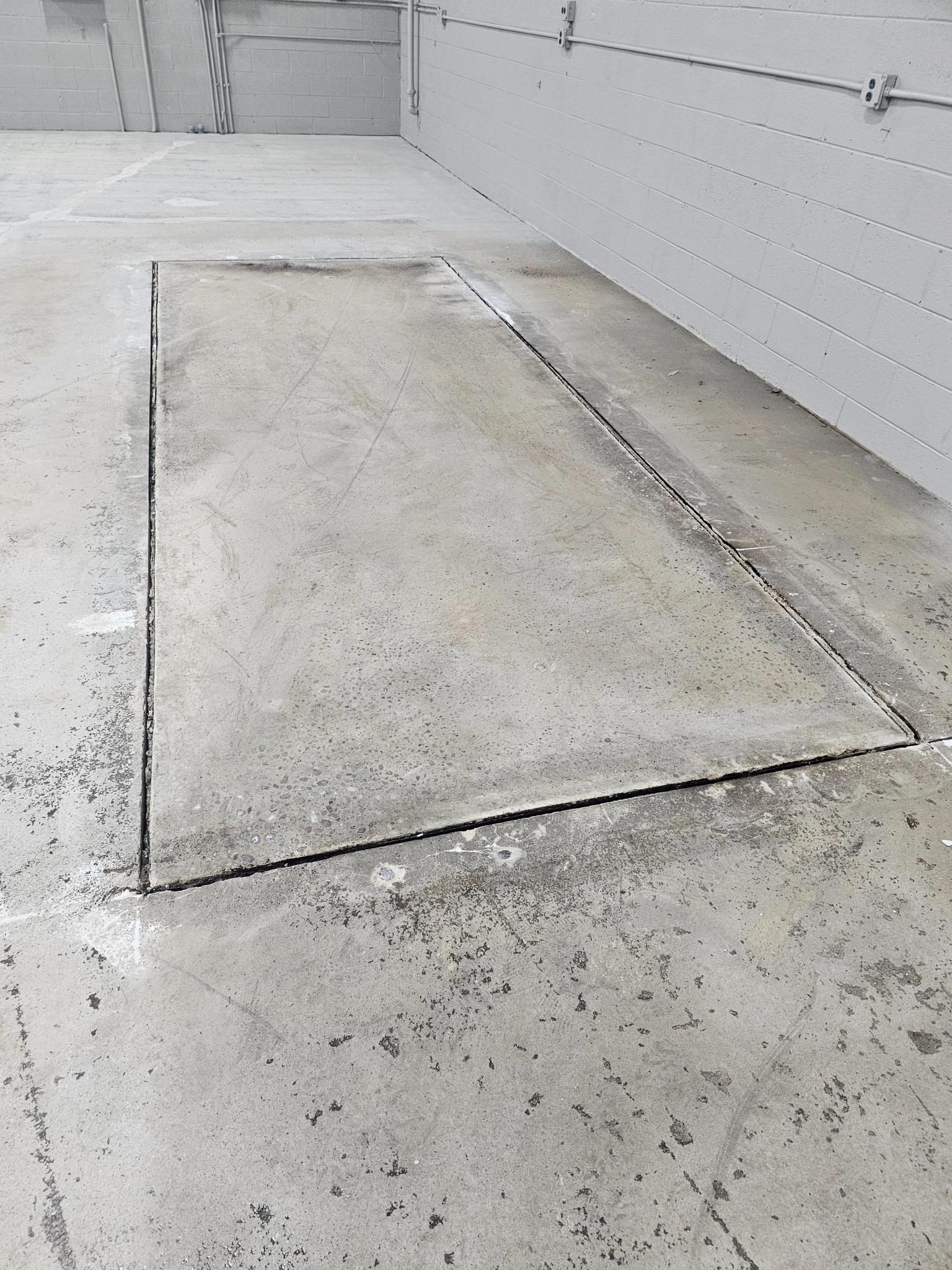Original concrete showing crack and joint detail before treatment